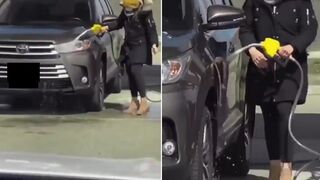 Woman spilling gasoline all over car thinks it's a water hose