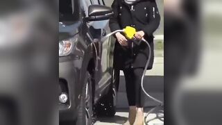 Woman spilling gasoline all over car thinks it's a water hose