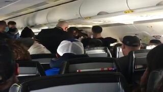 These people are fighting on a plane IN MID AIR